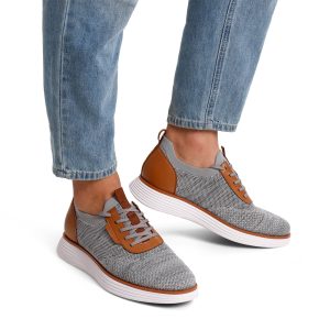 Stylish grey Bruno Marc sneakers with white soles and laces.
